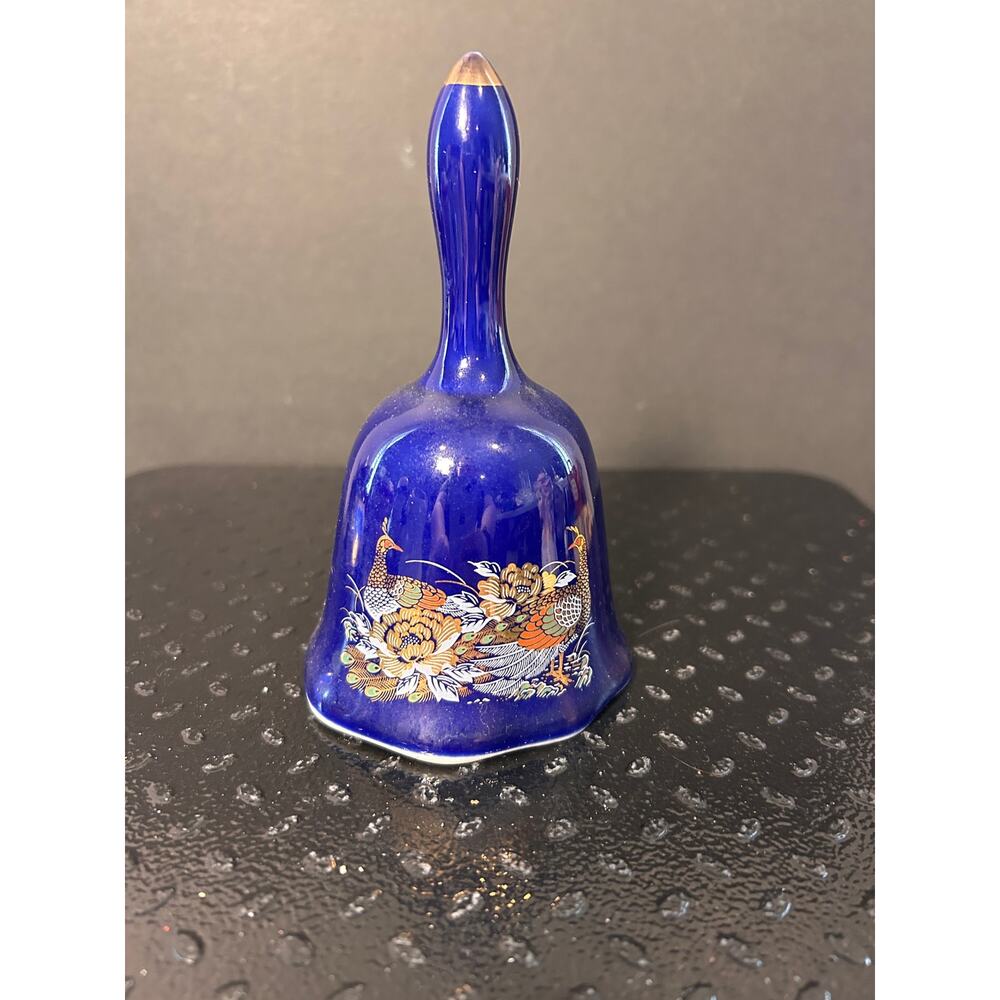 vintage cobalt blue porcelain bell with pheasant or peacock and floral designs.